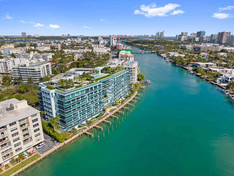 Aerial view of Bay Harbor Islands with luxury waterfront condos and turquoise water near Miami Beach