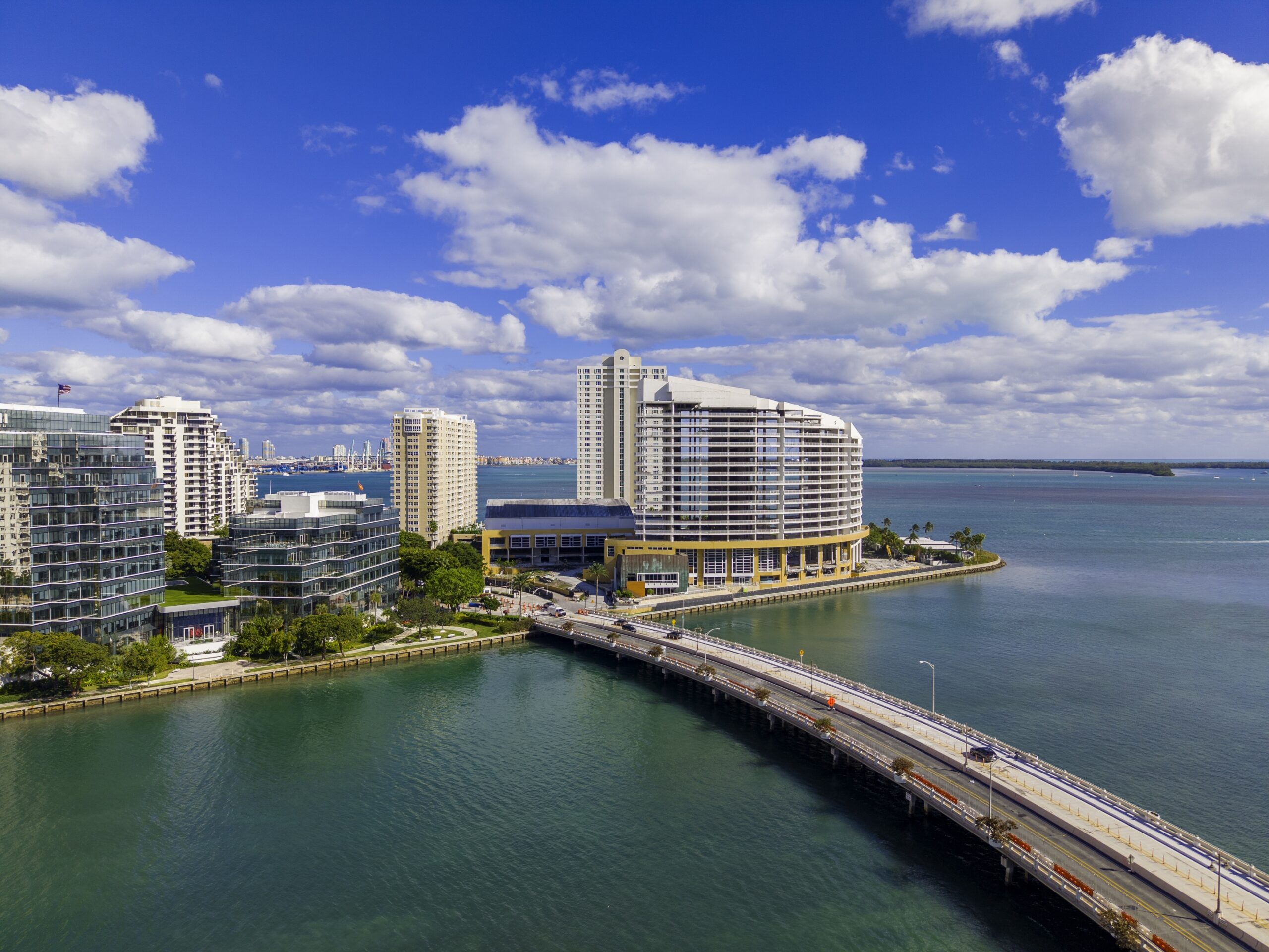 Brickell Miami high rise waterfront condos contrasting with the boutique scale of Bay Harbor Islands