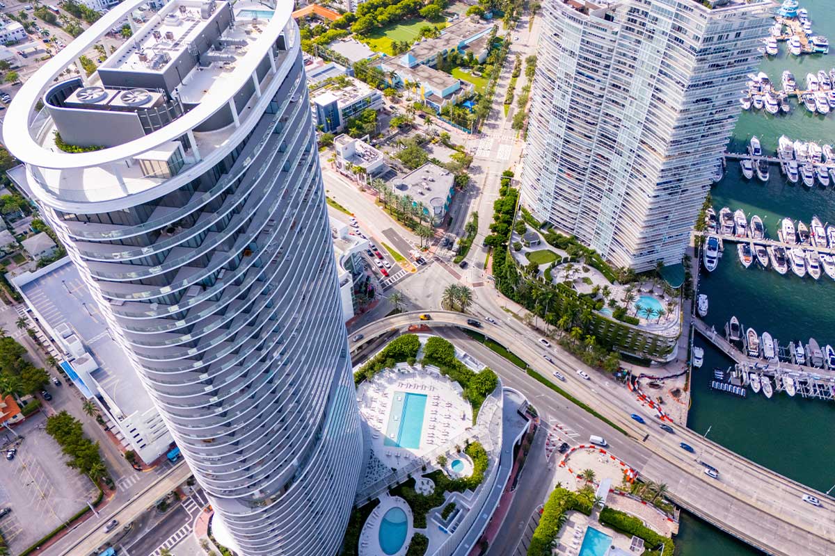 How do Florida property taxes affect luxury buyers purchasing a Miami home or condo