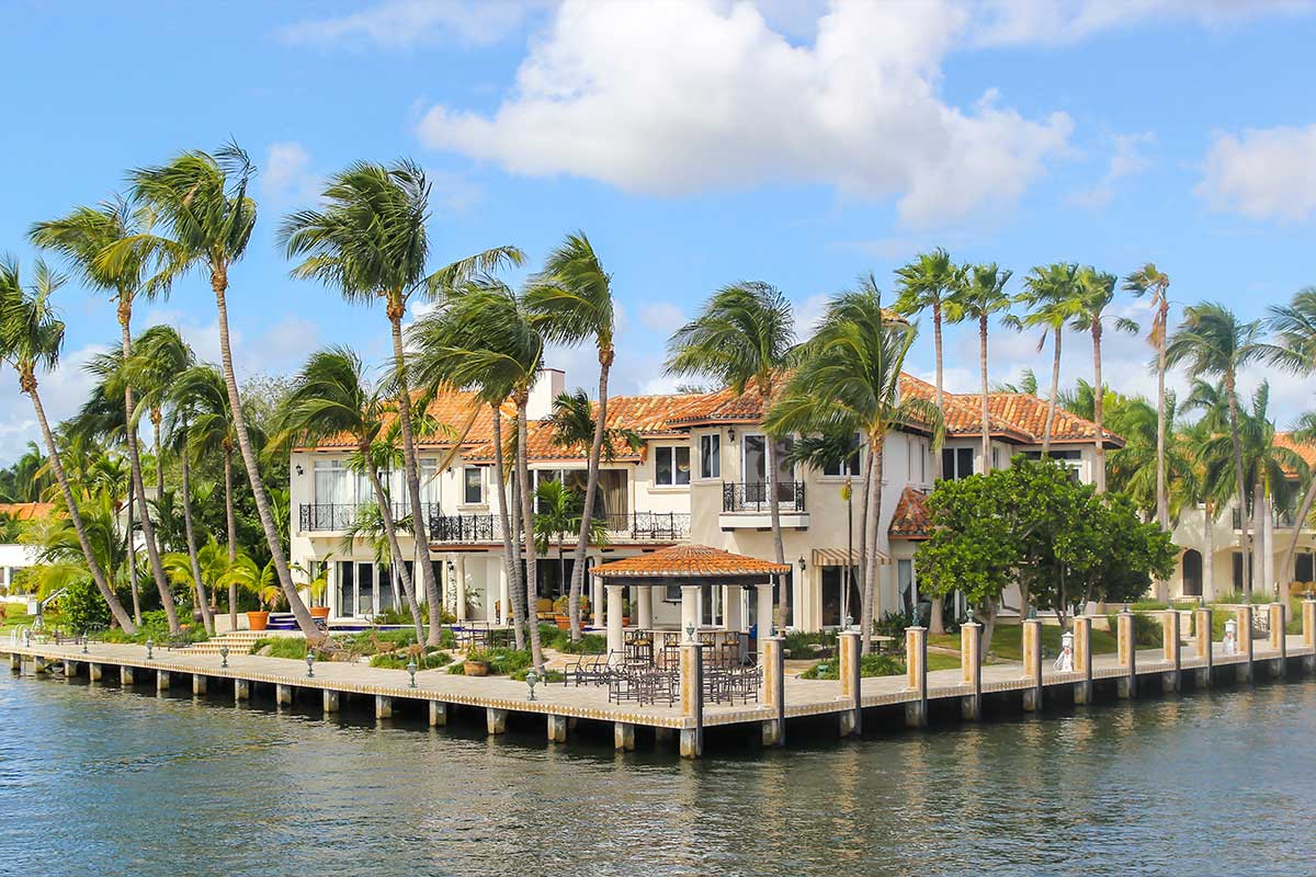 Why does neighborhood expertise matter for high-end properties in Miami